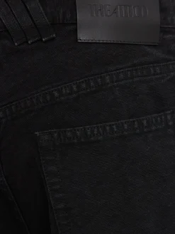 Jeans ampi in tela washed con cutout