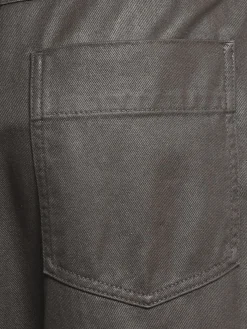 Pantaloni spalmati