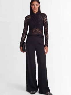 Top collo alto in pizzo stretch
